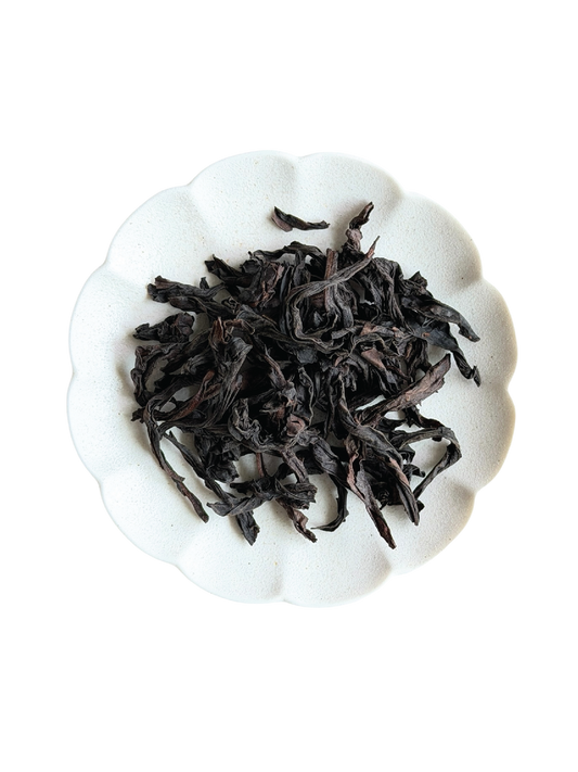 Roasted dried loose leaf stripped tea leaves. 