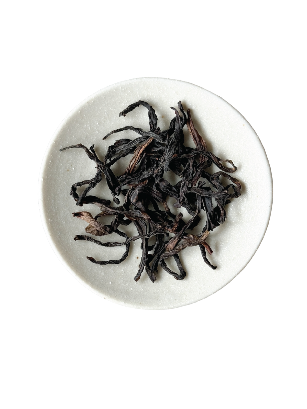 Loose-leaf twisted stripped tea leaves, dark brown to black in colour.
